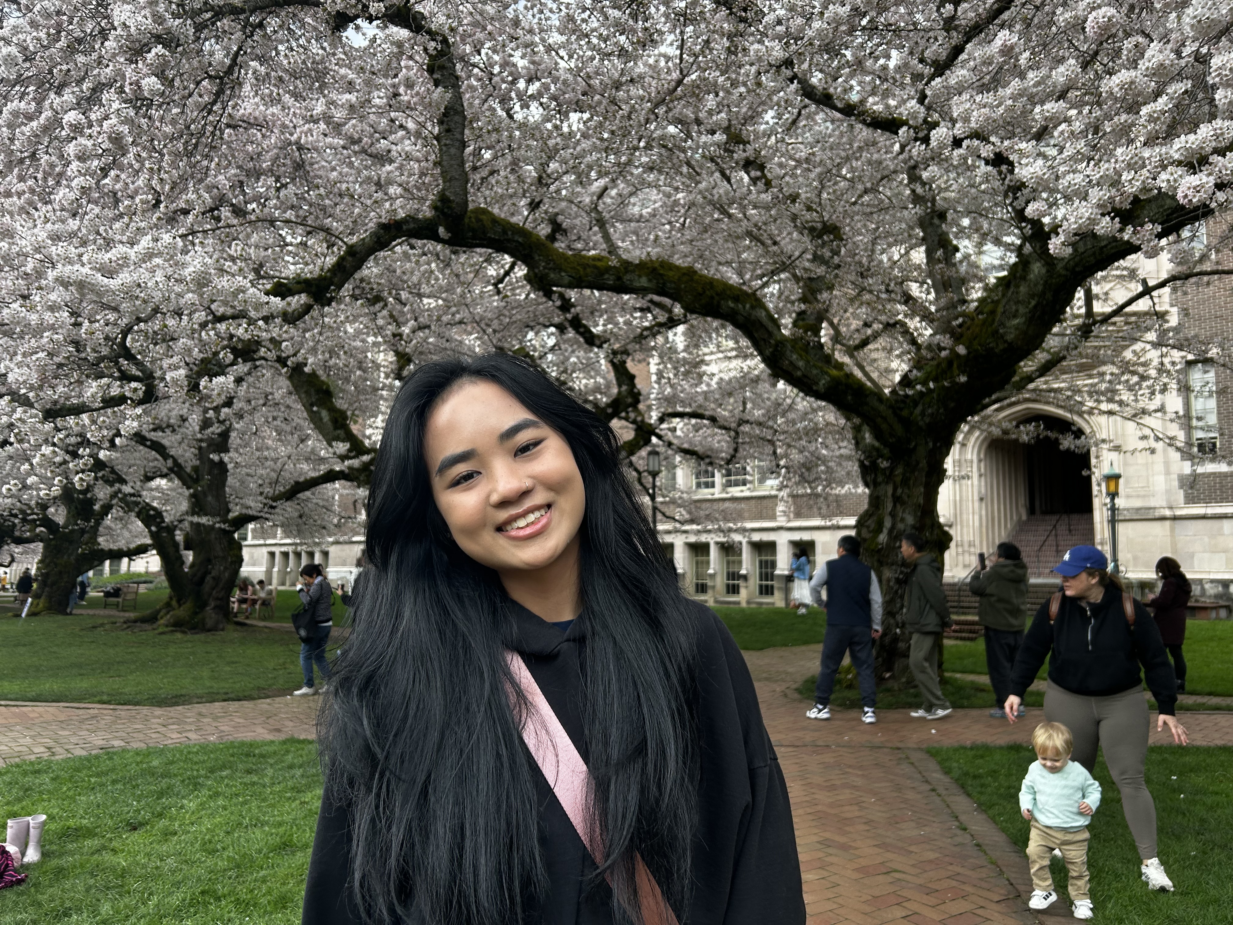 Portrait of Linda Dang with trees in background